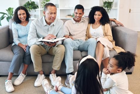 Senior family, children and reading book for learning, teaching and bible knowledge, spiritual deve.