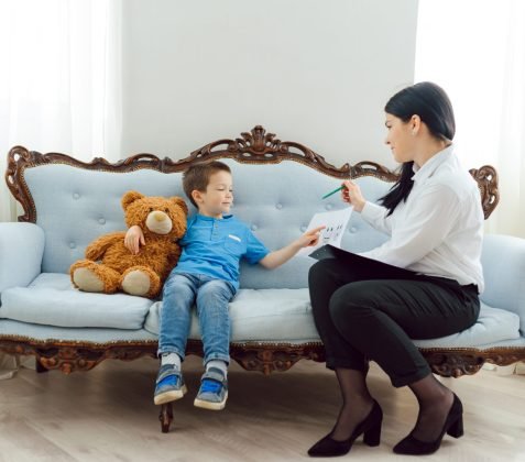 The concept of child psychology. A boy at the psychologist